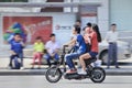 Young couple with child on an e-bike, Shanghai, China